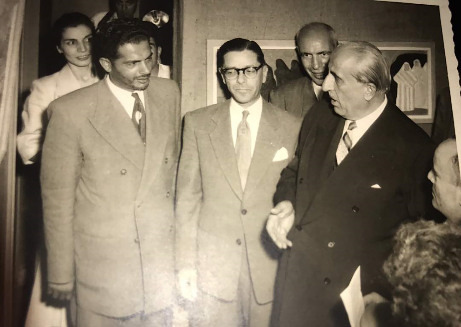An exhibition opening for Association of Syrian Artists in 1950s.&nbsp;Syrian president Shukri Al-Quwatli with artist Anwar Ali Arnaout (left), artist Jack Wardeh (right corner). Archive of artist Anwar Ali Arnaout.