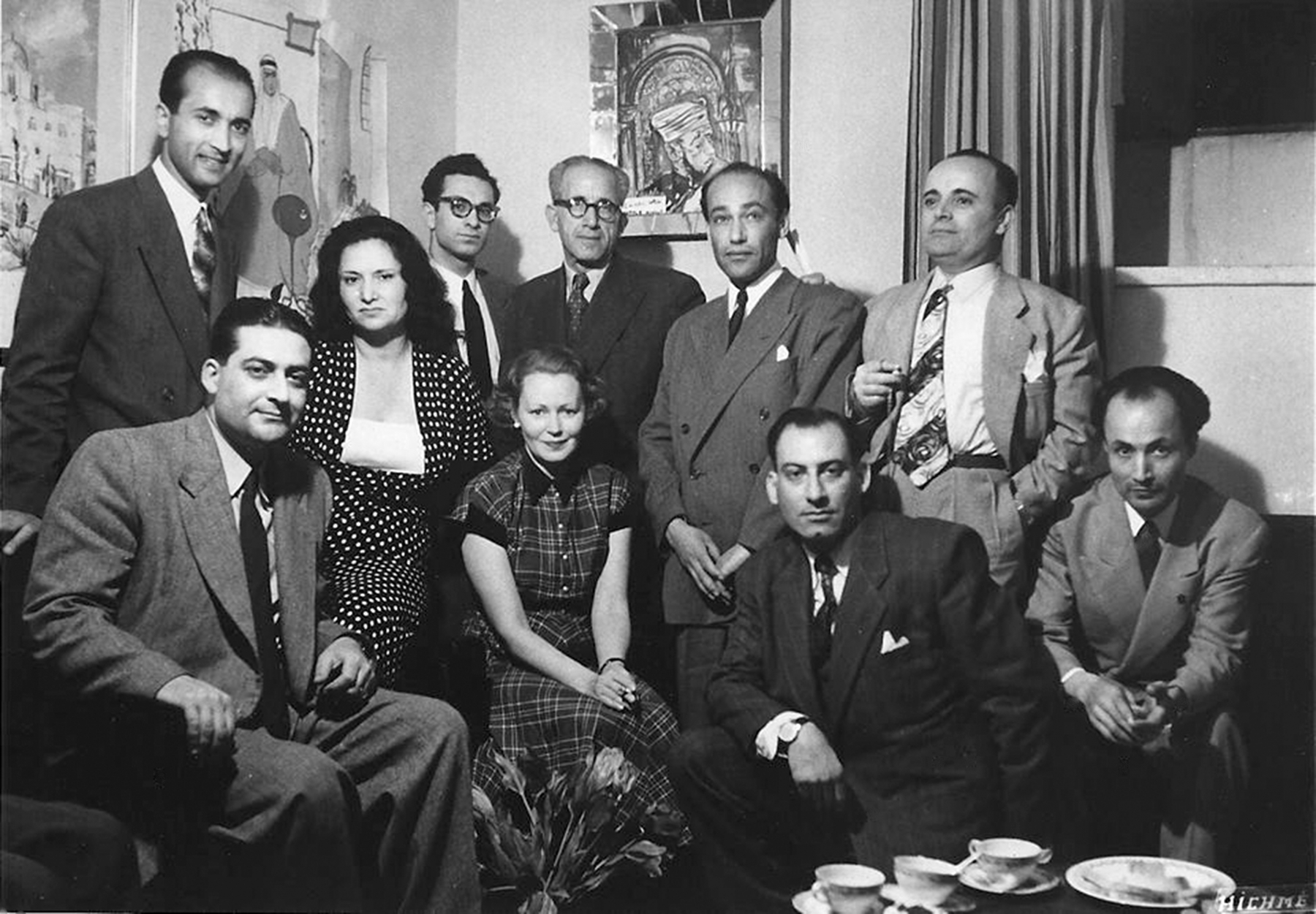 The Society for Lovers of Fine Arts, 3 April 1952. (Standing from right)&nbsp;Jack Wardeh, Nassir Shoura,&nbsp;Michael Kurcheh, Michel El Mir,&nbsp;Mahmoud Hammad; (sitting from right)&nbsp;Nazem Al-Jaafari,&nbsp;Robert Malaki, Eleanora Shatti (1913&ndash;2006), Munawwar Morelli (1912&ndash;2005) and Adnan Jabasini.